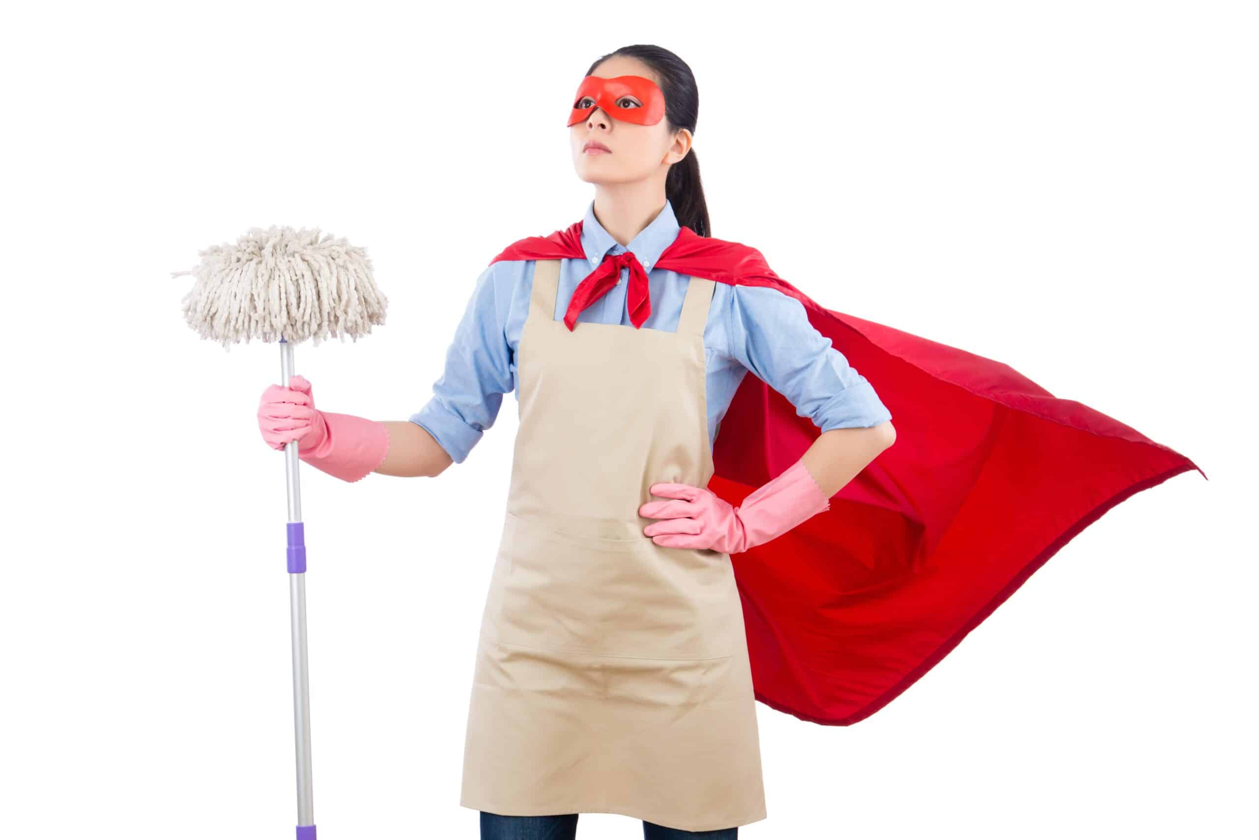 Image of woman in cape holding a mop