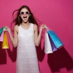 Excited Women With Shopping Bags