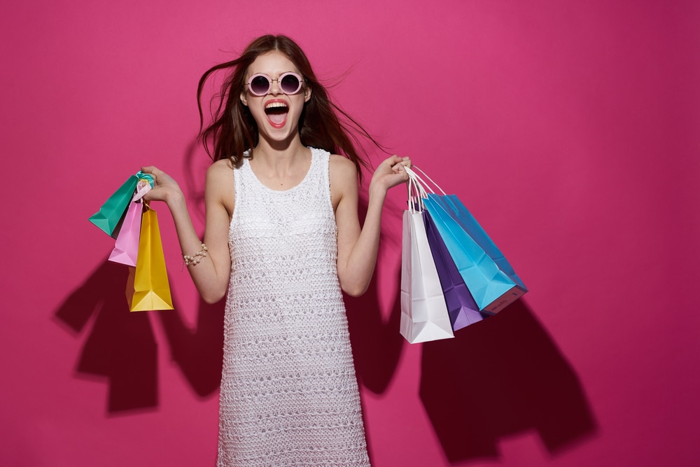 Excited Women With Shopping Bags