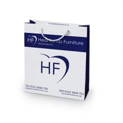 Heartlands furniture white and blue paper bag