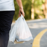 hand holding plastic bags