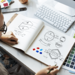 Girl Looking at drawings in notebook